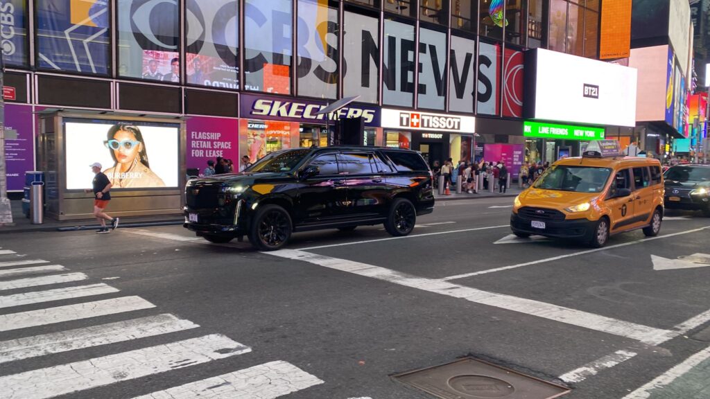 Black SUV running on the road