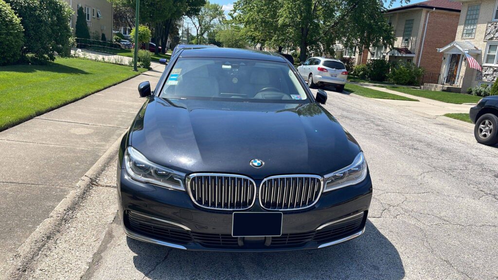 Luxury Sedan park on a road side